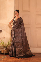 KAVVYA SOFT & LIGHT WEIGHT BLACK HANDLOOM SILK GOLDEN ZARI WEAVING SAREE IN TUSSAR FABRIC WITH BEAUTIFUL GEOMETRIC DESIGN ALLOVER THE SAREE COMES WITH BEAUTIFUL BLACK HEAVY WEAVING BLOUSE