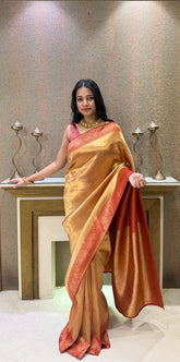 Elegant golden silk saree with rich red zari border