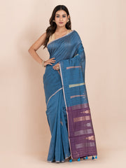 KAVVYA SOFT & LIGHT WEIGHT BLUE & RAW SILK BODY PLAIN WITH TREE MOTIFS ON THE BODY COMES WITH CONTRAST PURPLE PALLU WITH PURPLE COLOUR BLOUSE .