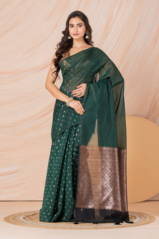 KAVVYA SOFT & LIGHT WEIGHT BOTTLE GREEN HANDLOOM  GOLDEN ZARI WEAVING SAREE IN TUSSAR FABRIC WITH BEAUTIFUL SMALL FLORAL MOTIFS ALLOVER THE SAREE COMES WITH BEAUTIFUL BIG MOTIF IN PALLU