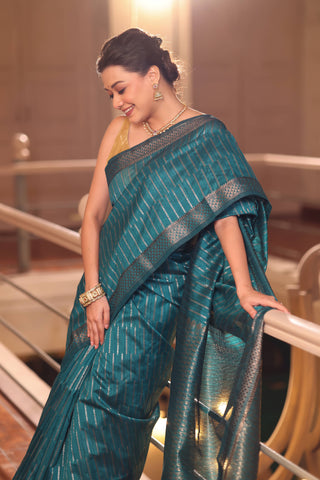 KAVVYA SOFT & LIGHT WEIGHT BLUE HANDLOOM WEAVED TUSSAR SAREE WITH GREY ZARI STRIPES ALLOVER THE SAREE COMES WITH SAME COLOUR BLOUSE
