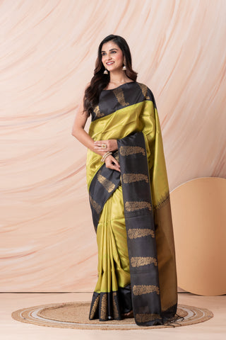 KAVVYA SOFT & LIGHT WEIGHT GREEN SILK SAREE FITH FINE GOLDEN ZARI WEAVING ALLOVER WITH CONTRAST BLACK BORDER AND PALLU HIGHLIGHTED WITH BEAUTIFUL MOTIFS