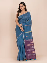 KAVVYA SOFT & LIGHT WEIGHT BLUE & RAW SILK BODY PLAIN WITH TREE MOTIFS ON THE BODY COMES WITH CONTRAST PURPLE PALLU WITH PURPLE COLOUR BLOUSE .