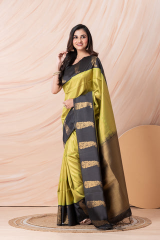 KAVVYA SOFT & LIGHT WEIGHT GREEN SILK SAREE FITH FINE GOLDEN ZARI WEAVING ALLOVER WITH CONTRAST BLACK BORDER AND PALLU HIGHLIGHTED WITH BEAUTIFUL MOTIFS
