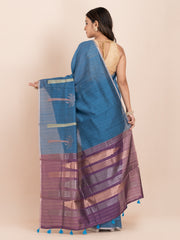 KAVVYA SOFT & LIGHT WEIGHT BLUE & RAW SILK BODY PLAIN WITH TREE MOTIFS ON THE BODY COMES WITH CONTRAST PURPLE PALLU WITH PURPLE COLOUR BLOUSE .