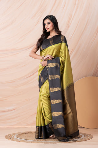 KAVVYA SOFT & LIGHT WEIGHT GREEN SILK SAREE FITH FINE GOLDEN ZARI WEAVING ALLOVER WITH CONTRAST BLACK BORDER AND PALLU HIGHLIGHTED WITH BEAUTIFUL MOTIFS