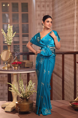 KAVVYA SOFT & LIGHT WEIGHT SKY BLUE CRAPE SAREE WITH SATIN BORDER AND BEAUTIFIL SILK ZARI WEAVING BORDER AND SMALL FLAMINGO MOTIFS ALL OVER THE SAREE COMES WITH SAME COLOUR WEAVED BLOUSE