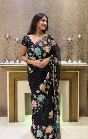 Elegant Black Organza Saree with floral sequence work.