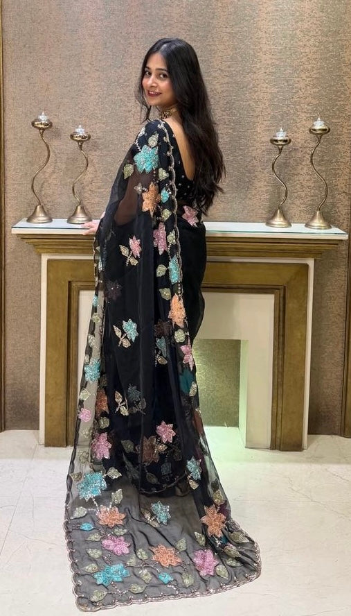 Elegant Black Organza Saree with floral sequence work.
