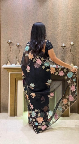Elegant Black Organza Saree with floral sequence work.