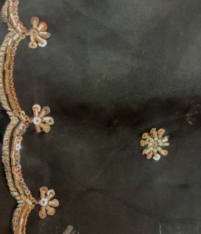 Elegant Black Organza Saree with floral sequence work.