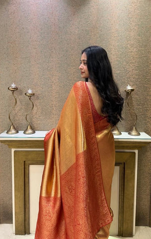 Elegant golden silk saree with rich red zari border