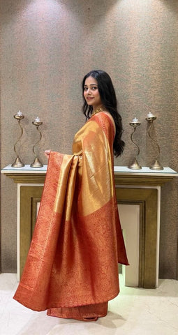 Elegant golden silk saree with rich red zari border