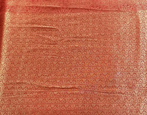 Elegant golden silk saree with rich red zari border